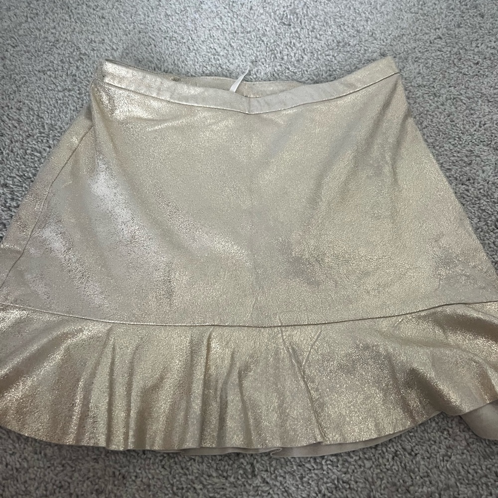 Free people skirt. Size 2. Gold. Never worn.